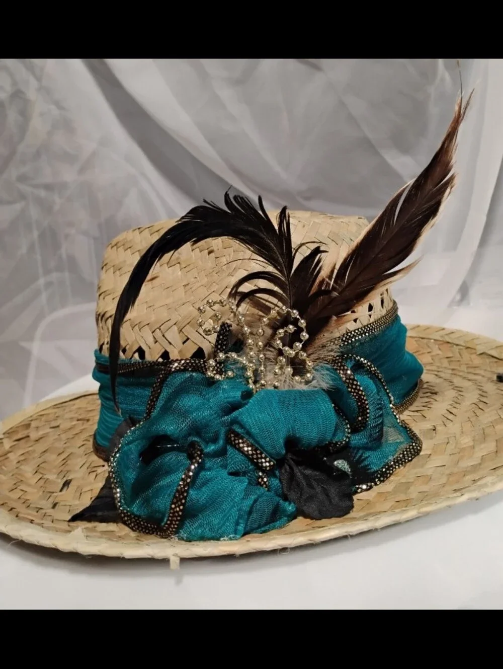 Handmade hat featuring feathers from our very own rooster, Mr. Kentucky!